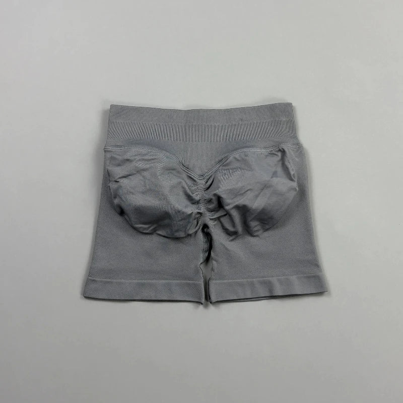 Pantalones cortos deportivos para mujer (tiro bajo, 4,5 pulgadas): ideales para fitness, ciclismo, running y yoga; diseño sin costuras y efecto "scrunch" para realzar los glúteos.