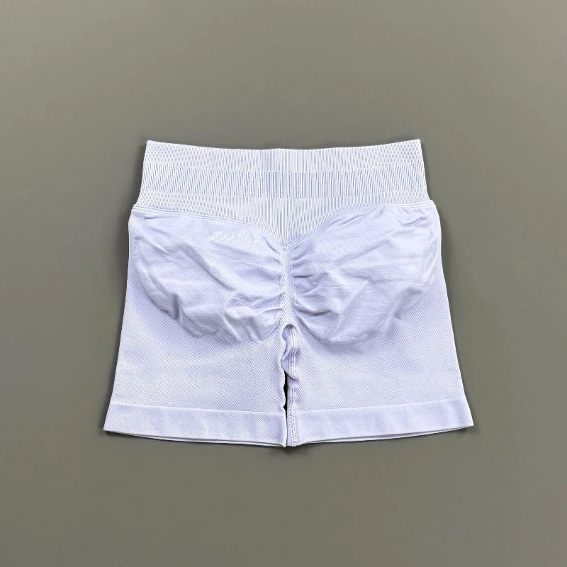 Pantalones cortos deportivos para mujer (tiro bajo, 4,5 pulgadas): ideales para fitness, ciclismo, running y yoga; diseño sin costuras y efecto "scrunch" para realzar los glúteos.