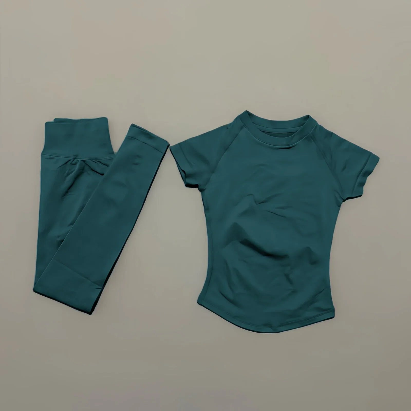 Conjunto deportivo de 2 piezas para mujer: camiseta de manga corta sin costuras y leggings deportivos con efecto realce de glúteos.