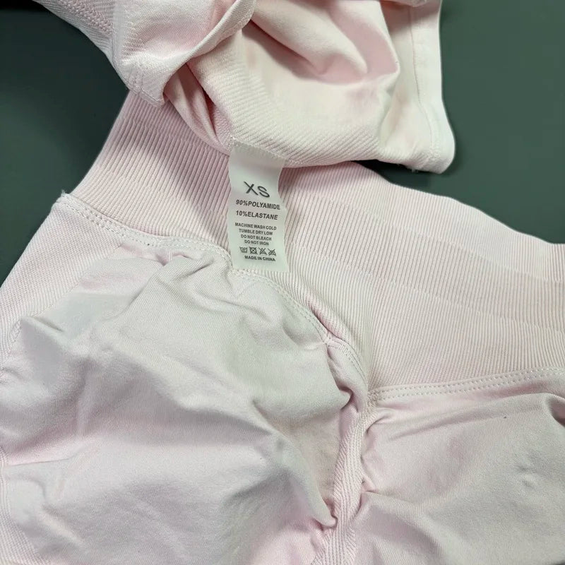 Conjunto deportivo de 2 piezas para mujer: camiseta de manga corta sin costuras y leggings deportivos con efecto realce de glúteos.
