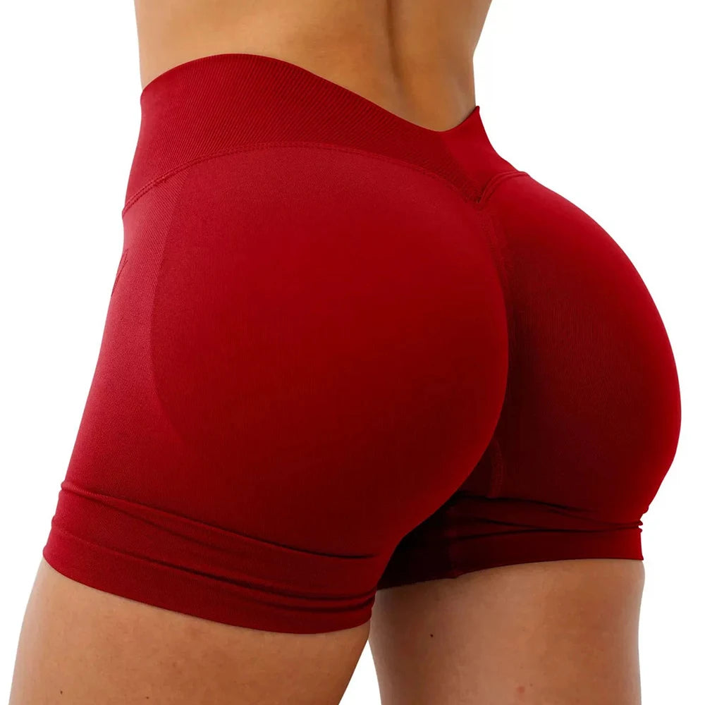 Shorts deportivos para mujer: sin costuras, ideales para yoga, fitness y entrenamiento; diseño con efecto realce de glúteos y cintura en forma de V.