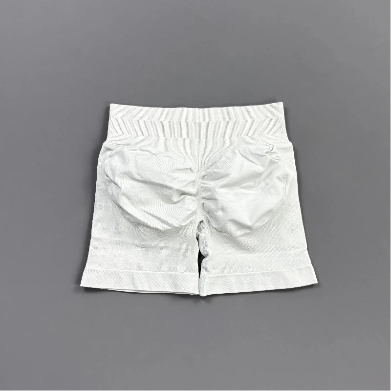 Pantalones cortos deportivos para mujer (tiro bajo, 4,5 pulgadas): ideales para fitness, ciclismo, running y yoga; diseño sin costuras y efecto "scrunch" para realzar los glúteos.