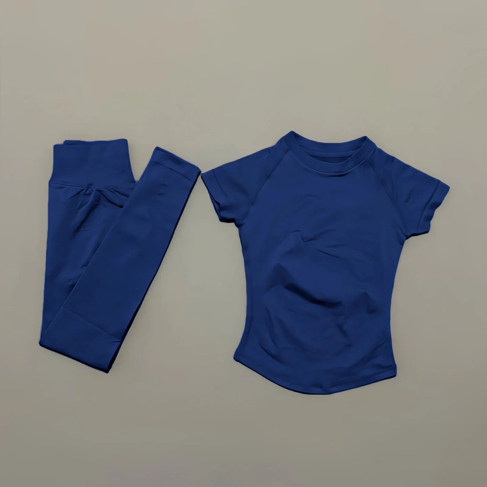 Conjunto deportivo de 2 piezas para mujer: camiseta de manga corta sin costuras y leggings deportivos con efecto realce de glúteos.